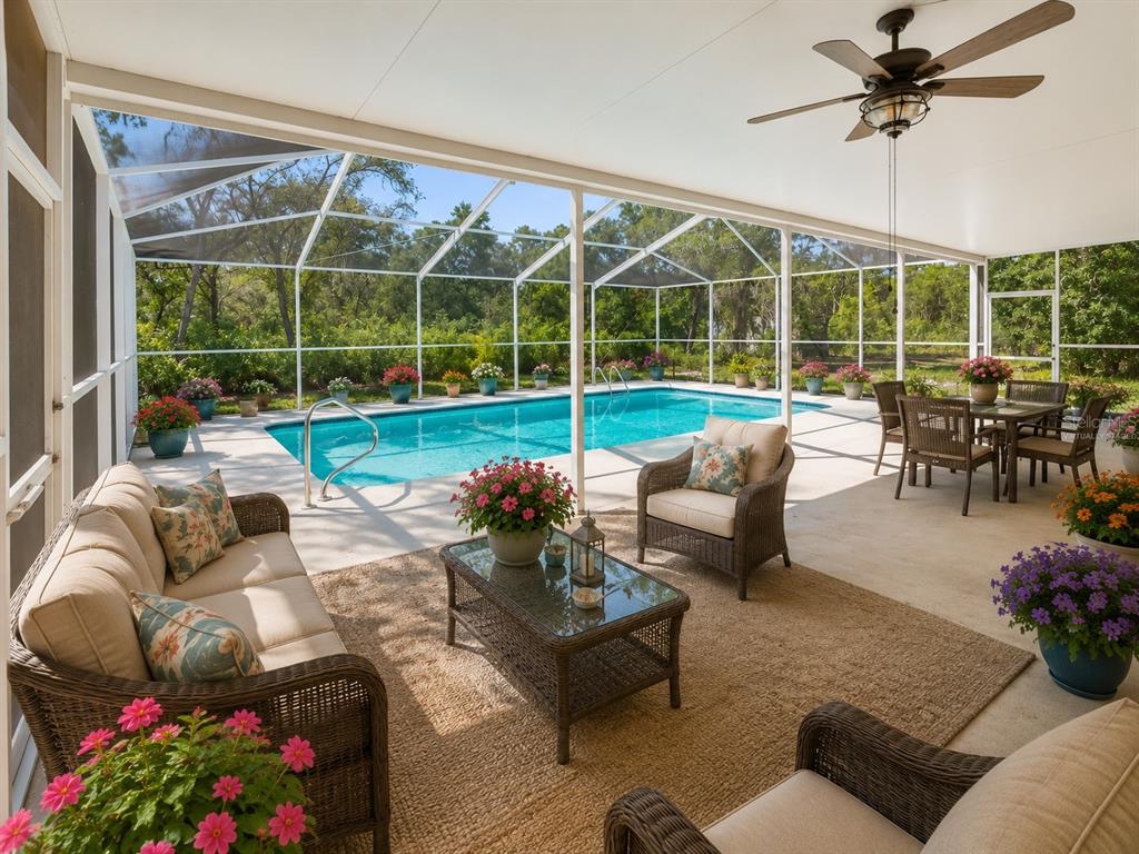 15420 Aubrey Avenue Spring Hill, FL 34610 - Photo 27 of 28 a living room with furniture and a large window