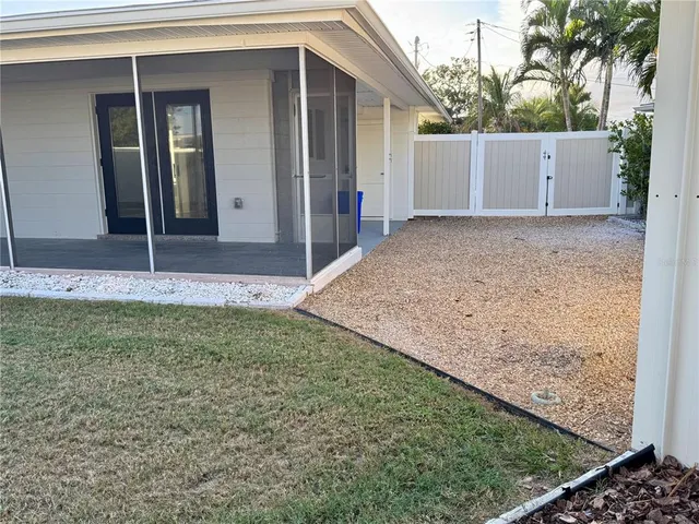 a view of a backyard of the house