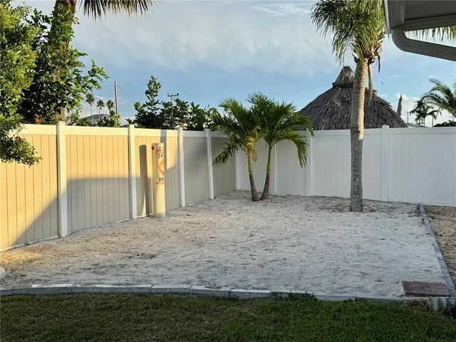 a view of a backyard of the house