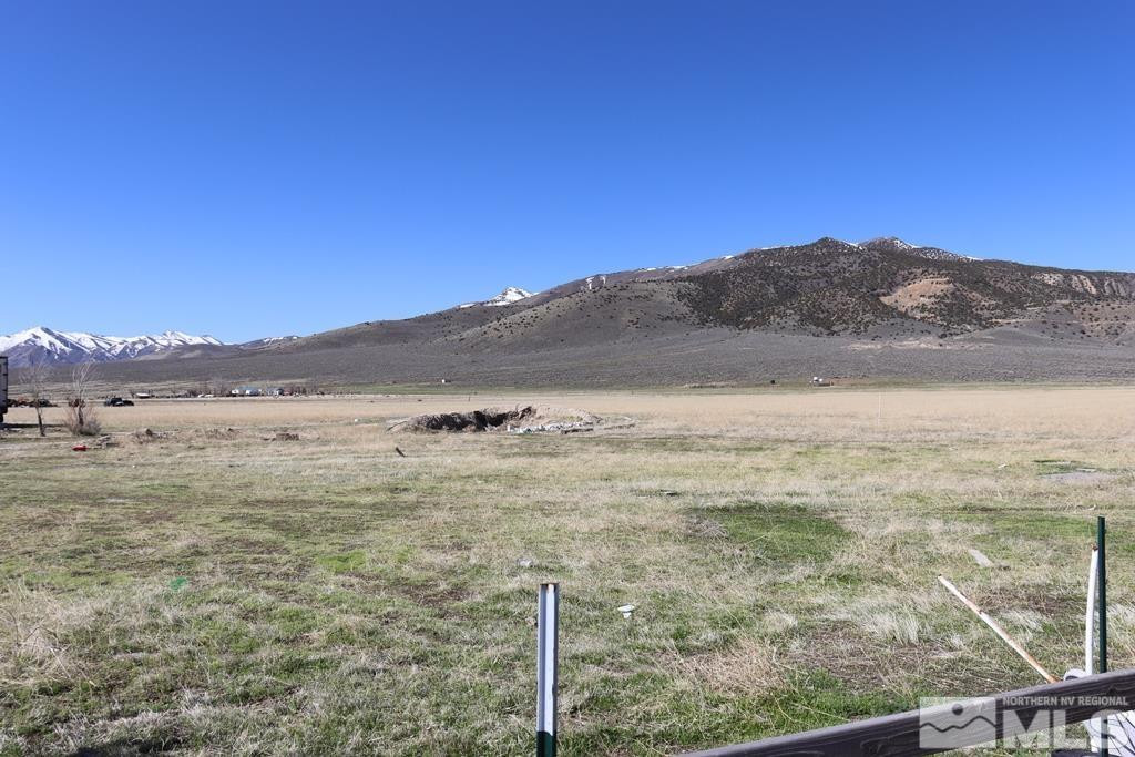 a view of an ocean and mountain