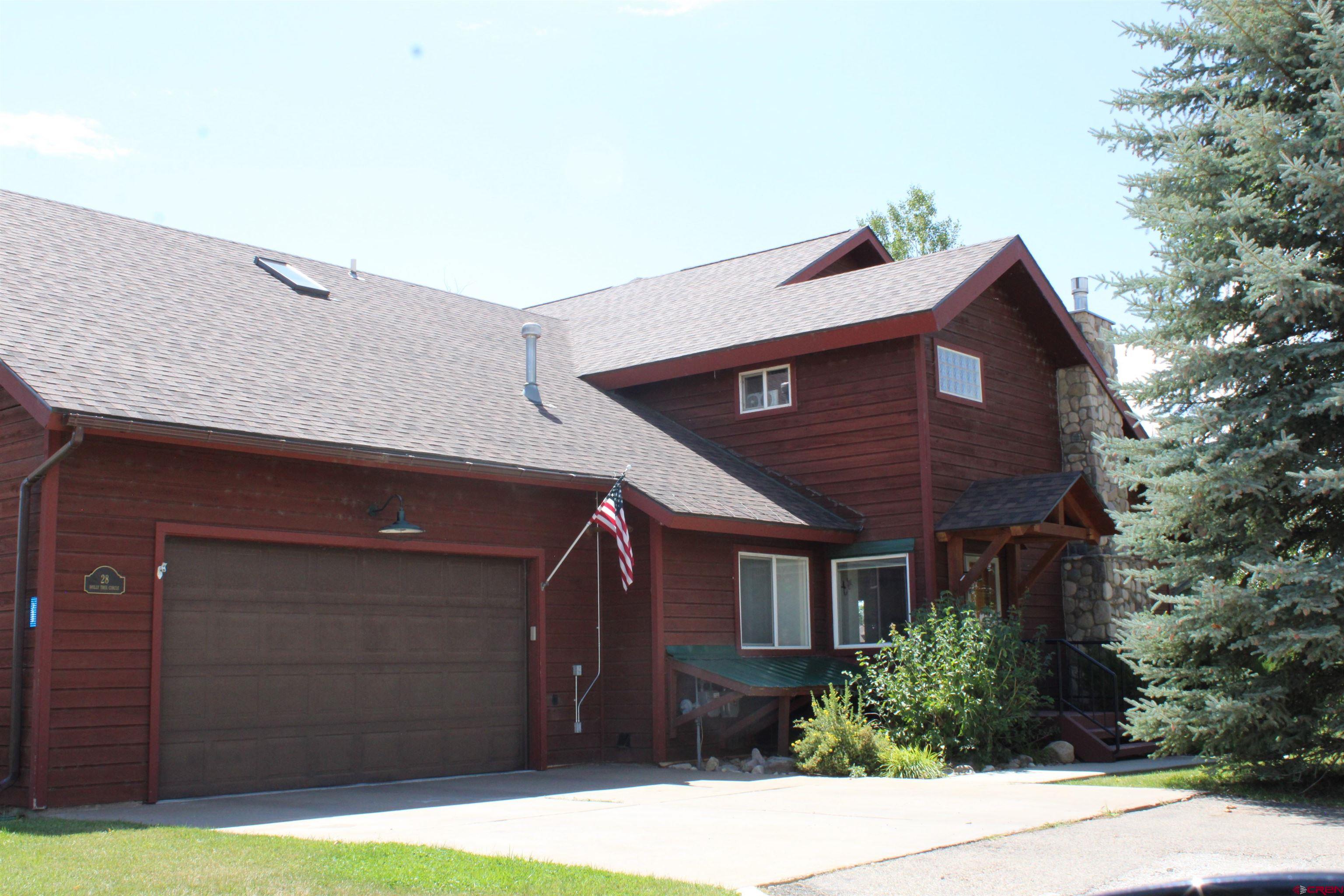 28 Holly Tree Circle Pagosa Springs, CO 81147 - Photo 1 of 27 a front view of a house with garage
