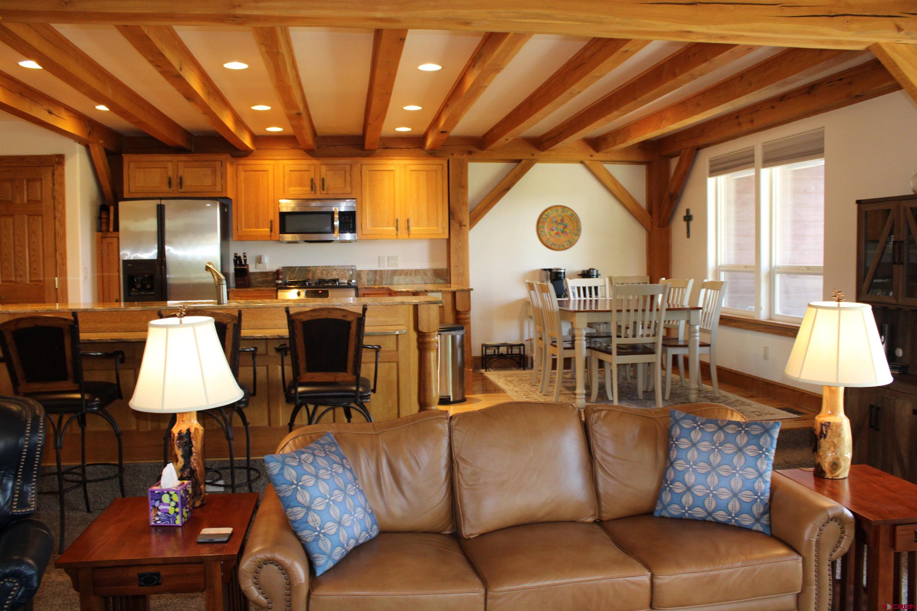 28 Holly Tree Circle Pagosa Springs, CO 81147 - Photo 13 of 27 a view of a livingroom with furniture and a fireplace