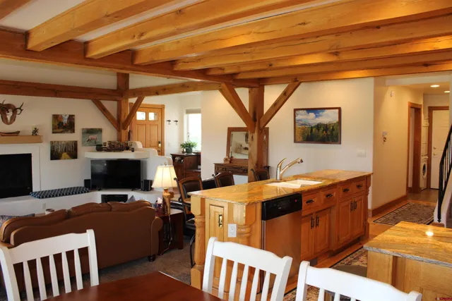 a view of a livingroom with furniture and a fireplace