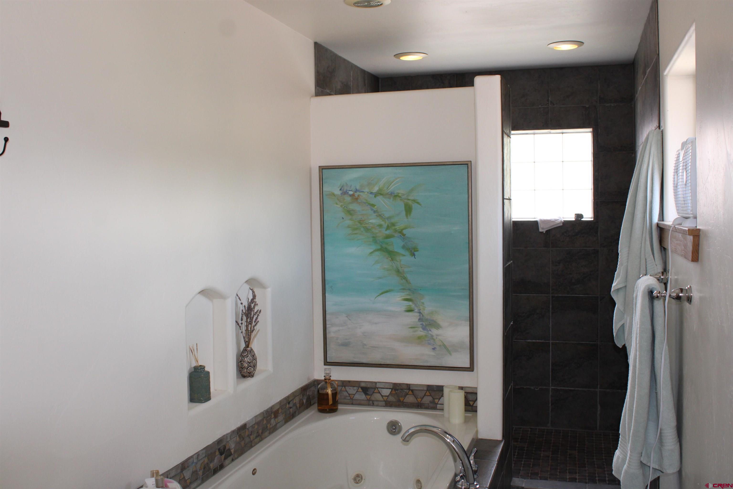 28 Holly Tree Circle Pagosa Springs, CO 81147 - Photo 24 of 27 a bathroom with a tub and a sink