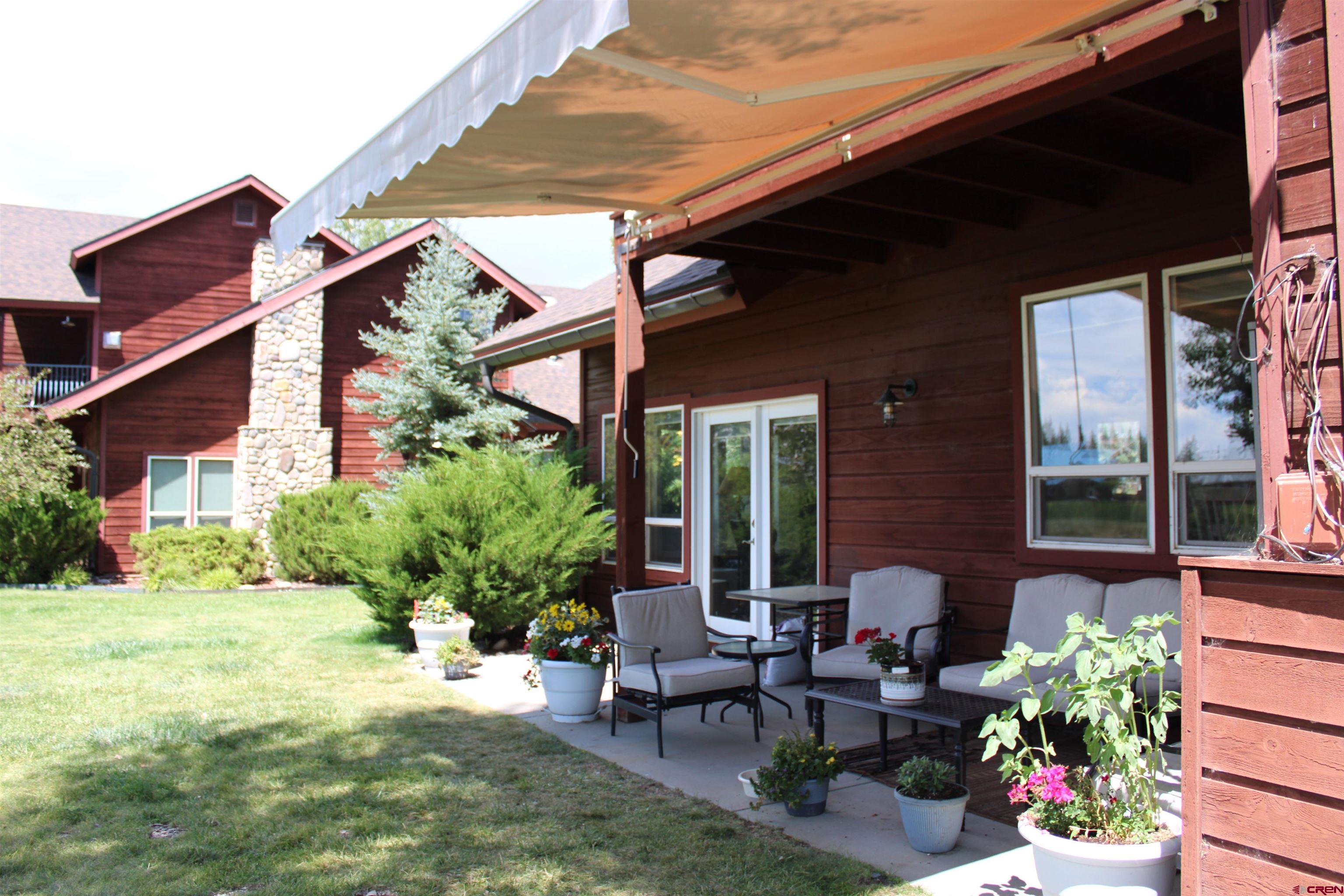 28 Holly Tree Circle Pagosa Springs, CO 81147 - Photo 27 of 27 a view of a house with backyard and sitting area