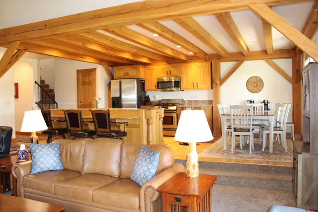 a living room with furniture and a lamp