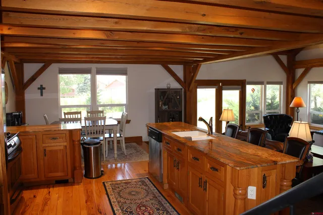 a view of a dining room with furniture window and outside view