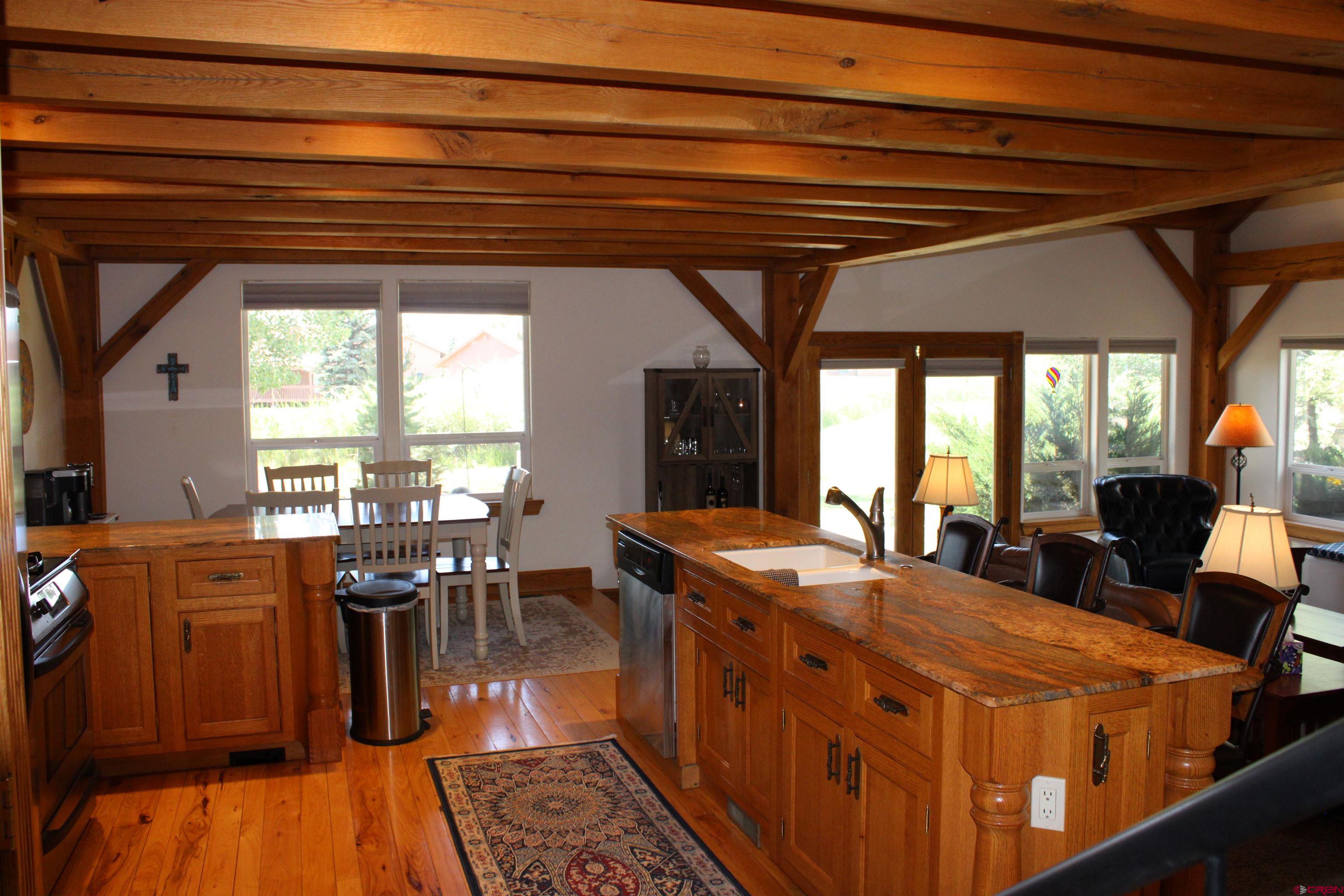 28 Holly Tree Circle Pagosa Springs, CO 81147 - Photo 7 of 27 a view of a dining room with furniture window and outside view