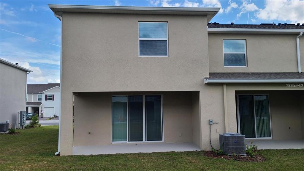 1310 Mako Way Kissimmee, FL 34741 - Photo 8 of 26 a view of a house with a yard