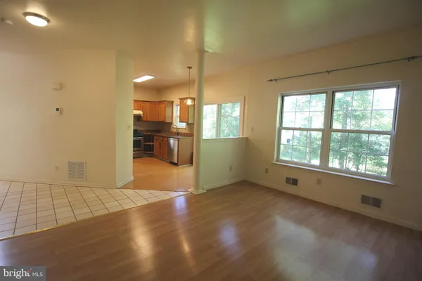 a view of empty room with a fireplace