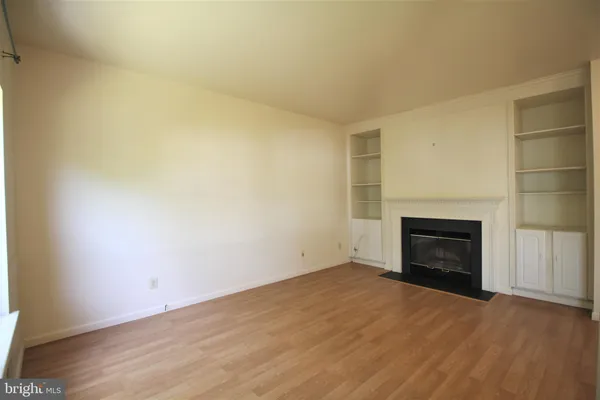 a living room with furniture window and a flat screen tv