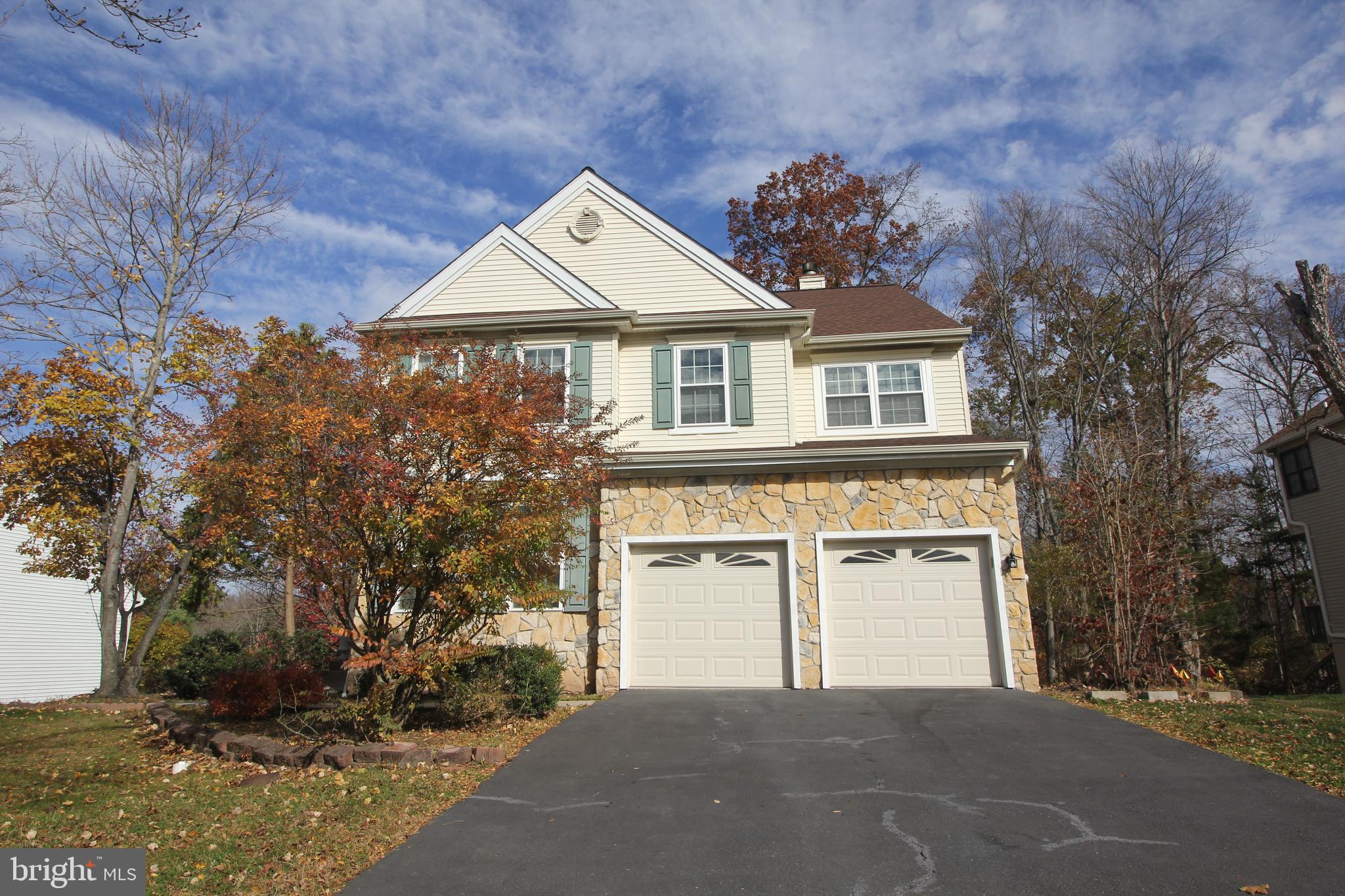 92 Harvard Circle Princeton, NJ 08540 - Photo 2 of 40 a front view of a house with a yard