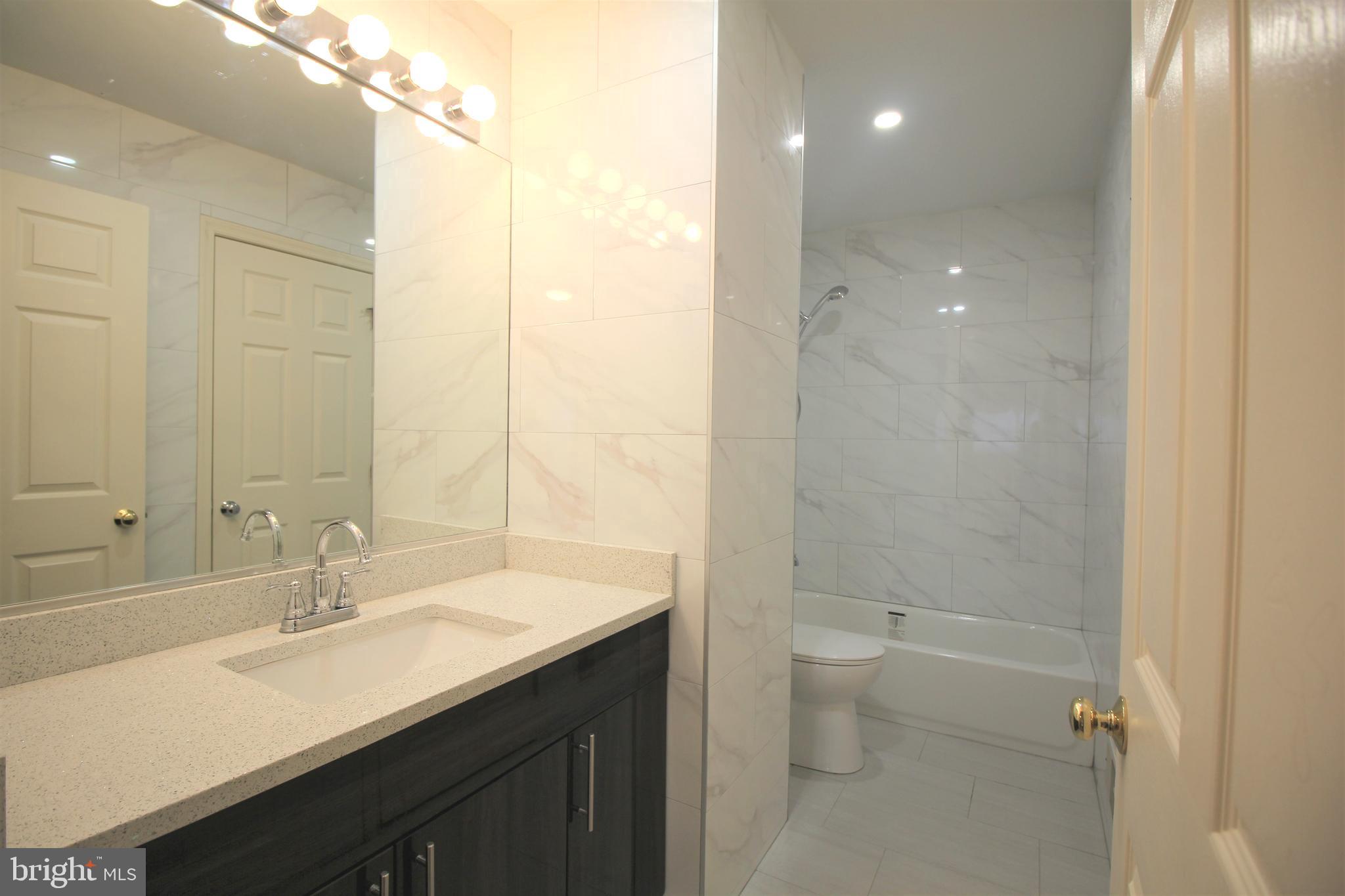 92 Harvard Circle Princeton, NJ 08540 - Photo 24 of 40 a bathroom with a sink a toilet and shower