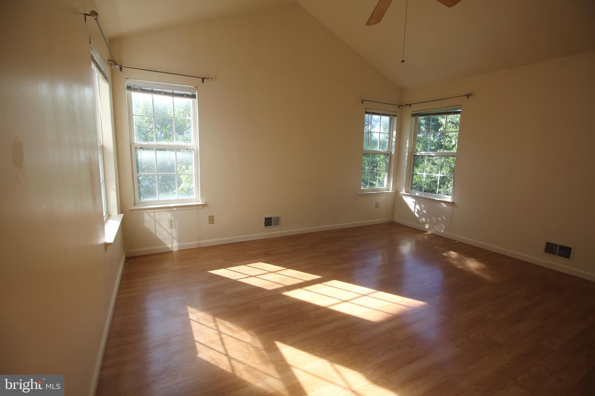 92 Harvard Circle Princeton, NJ 08540 - Photo 27 of 40 a view of empty room with wooden floor and fan