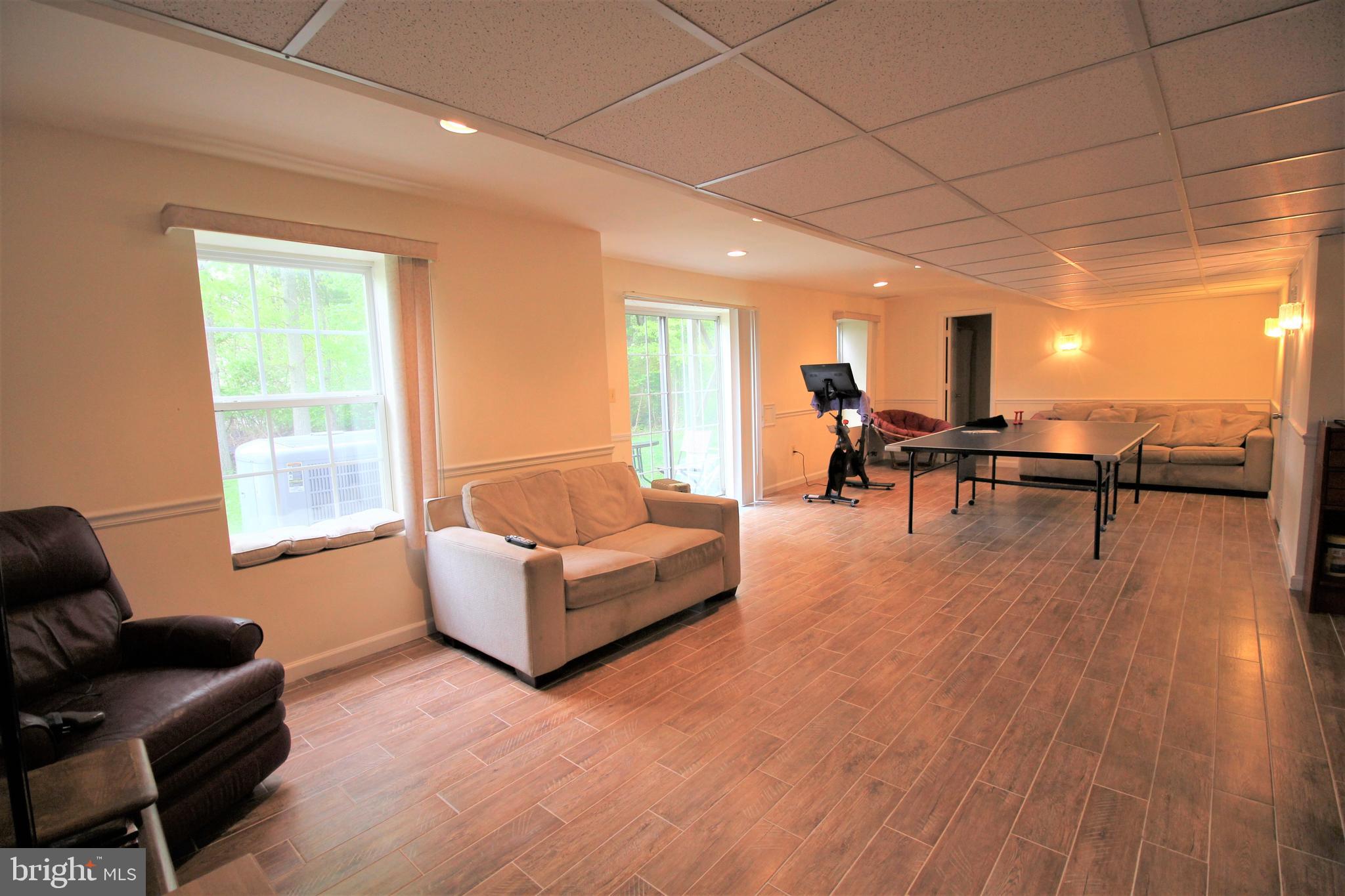 92 Harvard Circle Princeton, NJ 08540 - Photo 32 of 40 a living room with furniture and a wooden floor