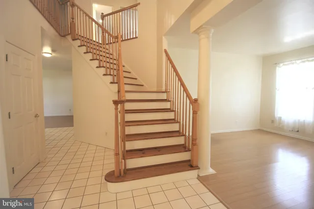 a view of entryway with stairs and wooden floor
