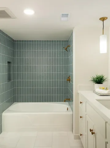 a bathroom with a bathtub and a shower