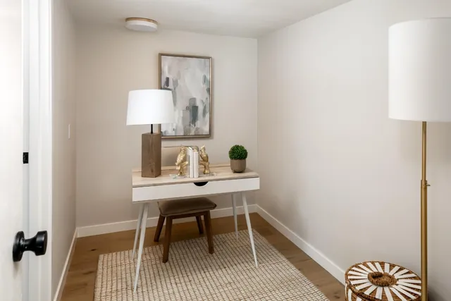 a workspace with furniture and a lamp