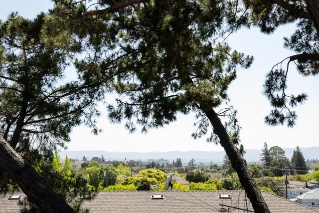 a view of porch with seating space and trees