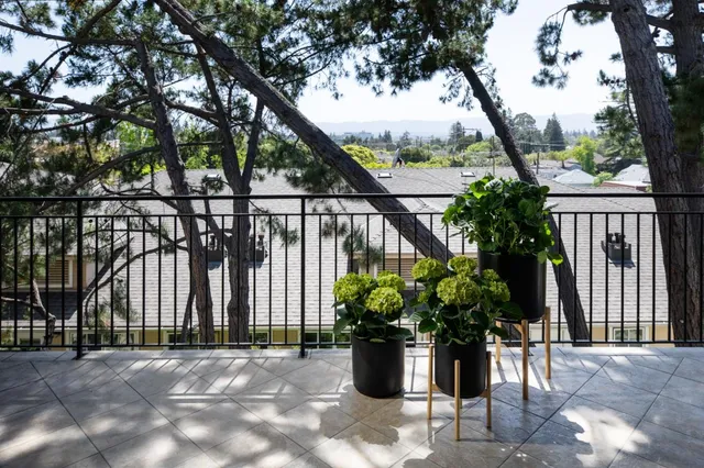 a view of balcony with furniture