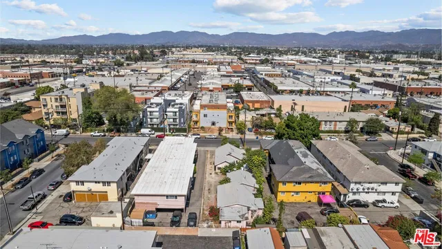 an aerial view of residential houses and city street