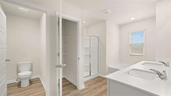 a bathroom with a sink a tub and a mirror