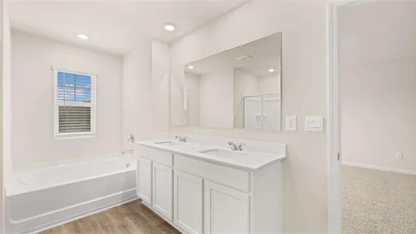 a bathroom with a bathtub and a sink