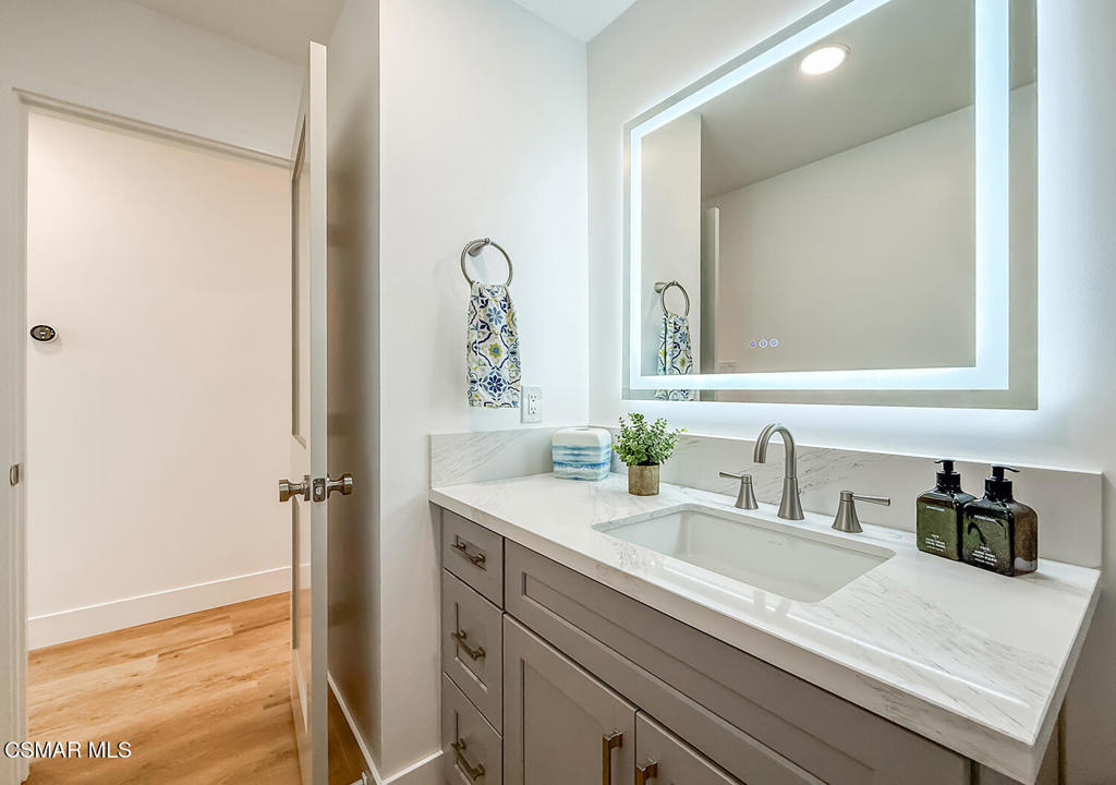5040 Dolphin Way Oxnard, CA 93035 - Photo 19 of 26 a bathroom with a sink and a mirror