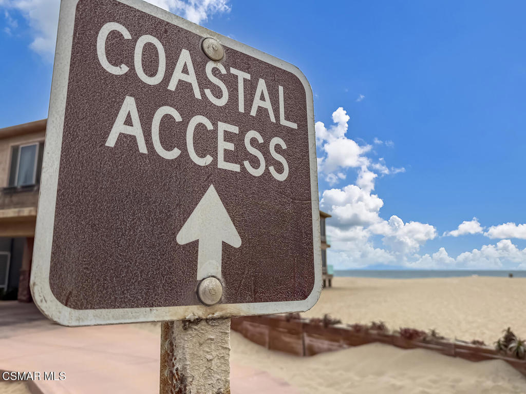 5040 Dolphin Way Oxnard, CA 93035 - Photo 22 of 26 a front view of a house with a lake view