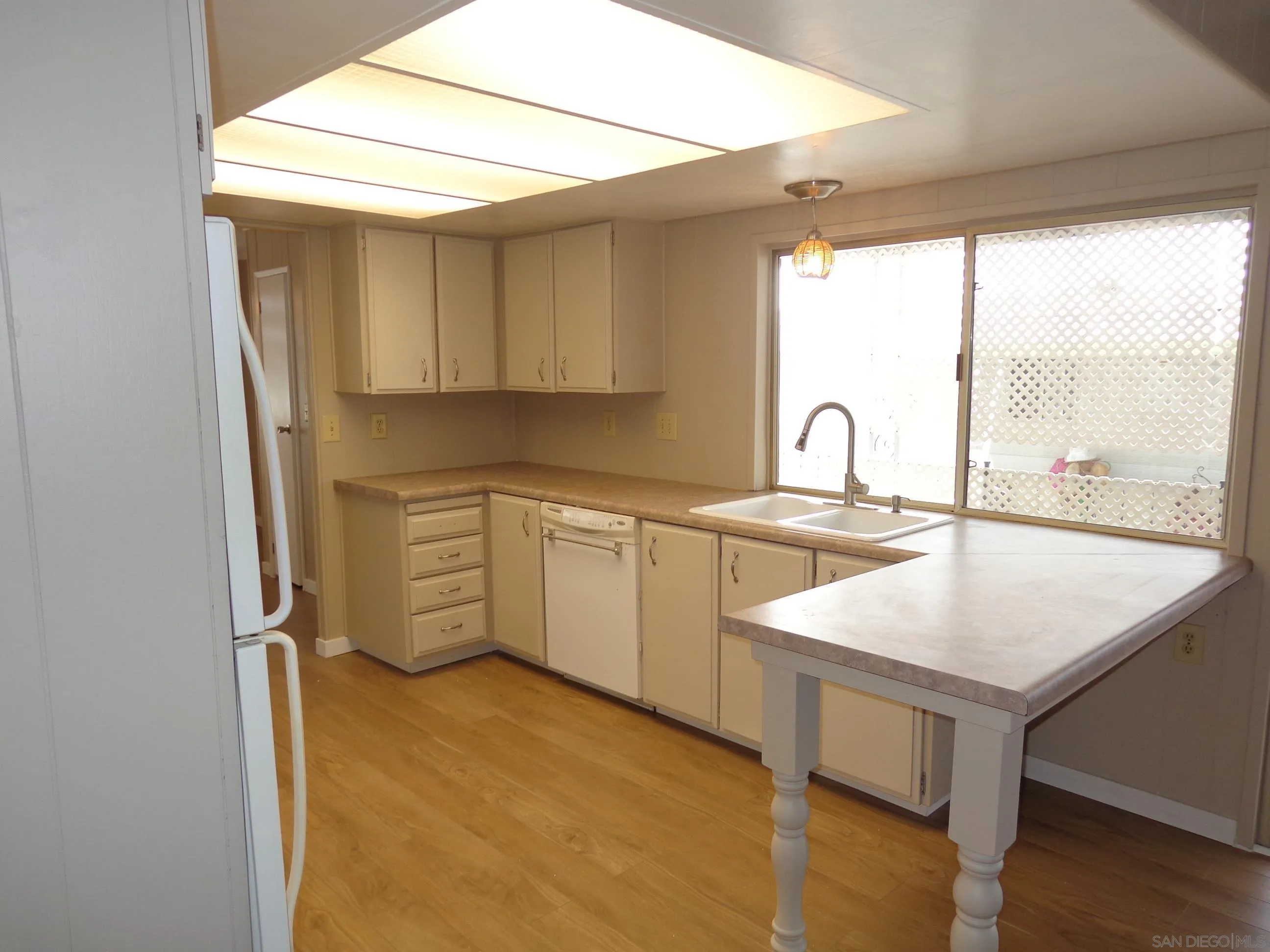 106 Havenview Lane Oceanside, CA 92056 - Photo 11 of 24 a kitchen with a sink a stove and cabinets