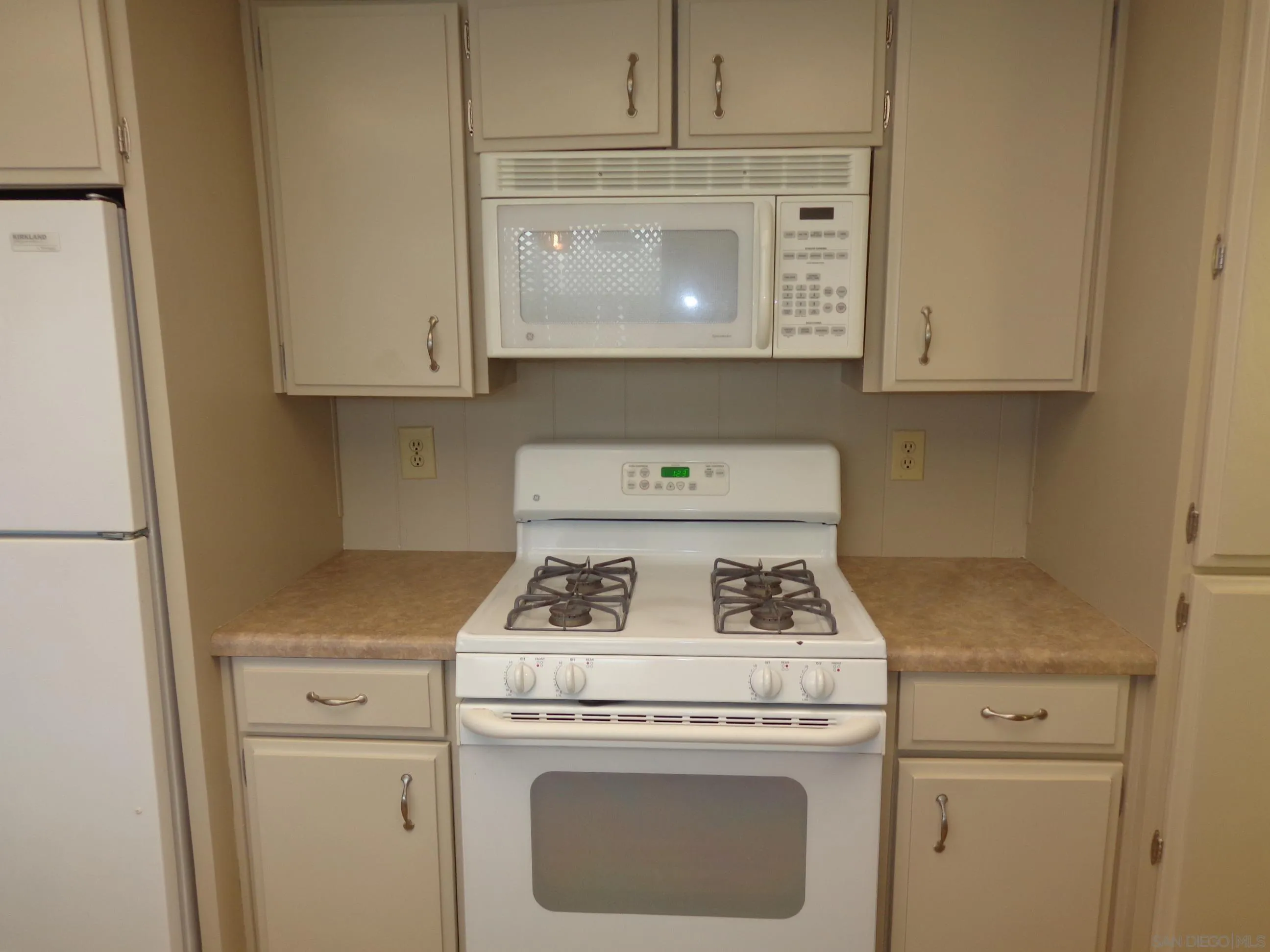 106 Havenview Lane Oceanside, CA 92056 - Photo 12 of 24 a stove top oven sitting inside of a kitchen