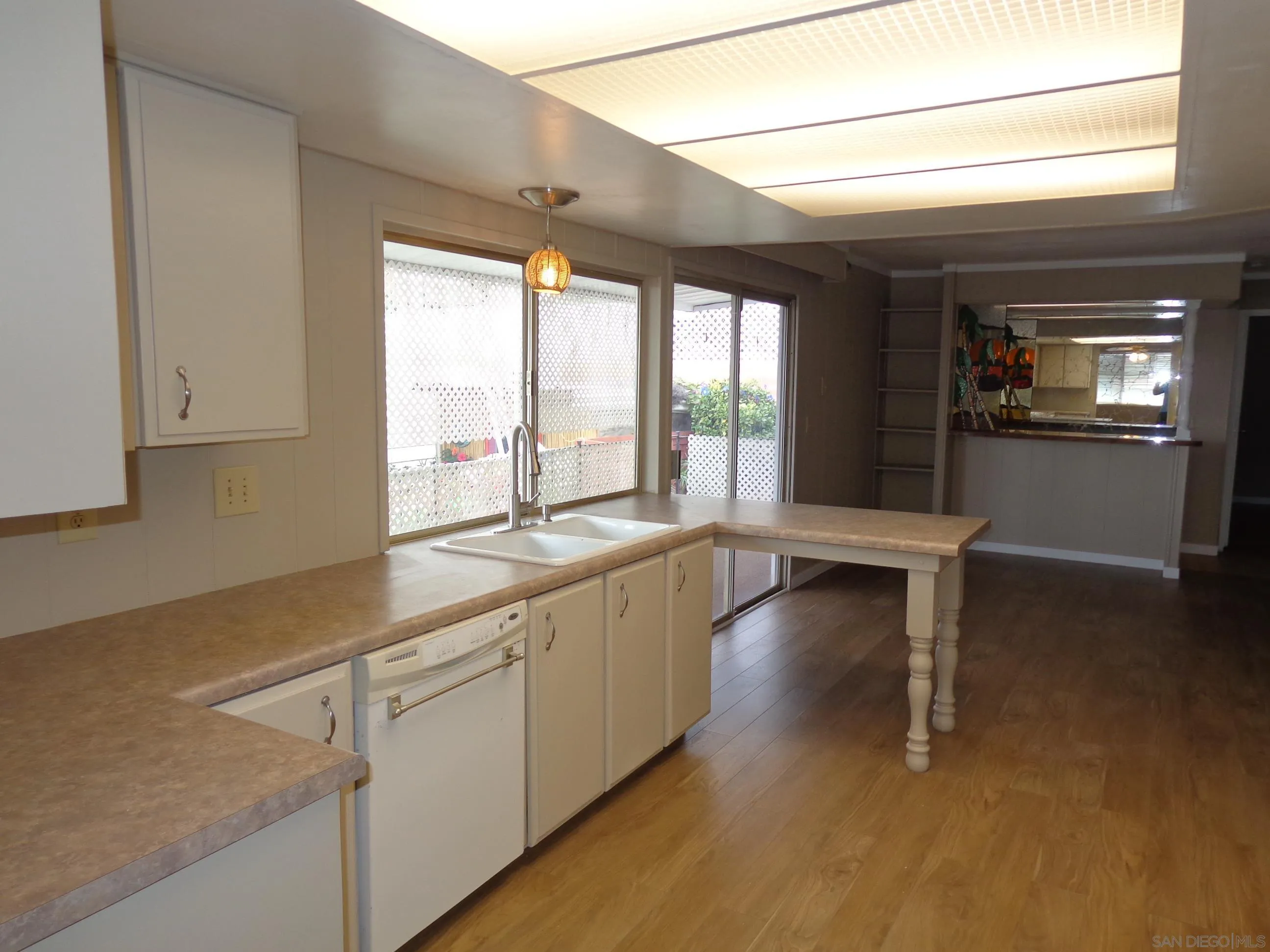 106 Havenview Lane Oceanside, CA 92056 - Photo 13 of 24 a view of a kitchen with a sink and cabinets