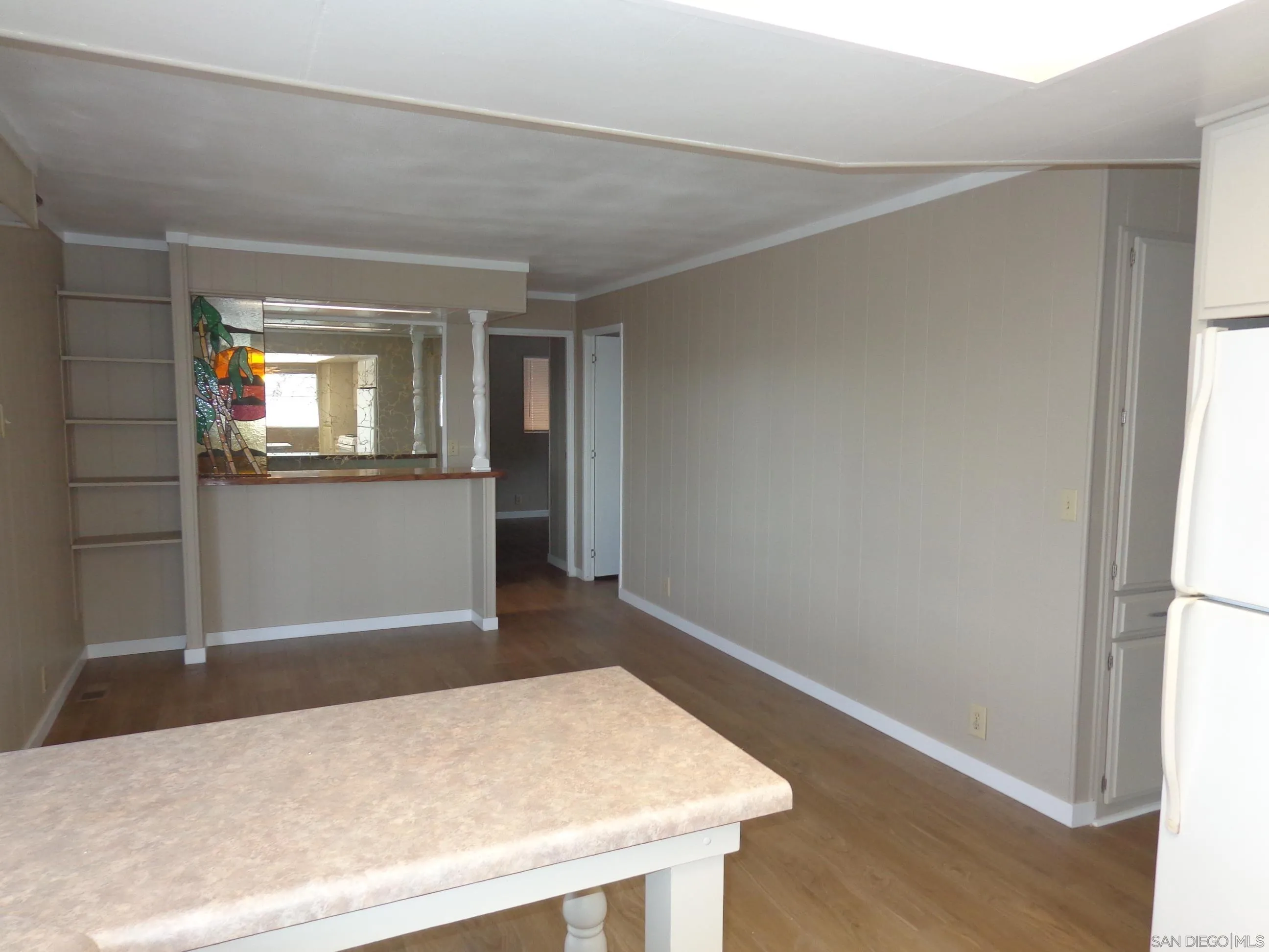 106 Havenview Lane Oceanside, CA 92056 - Photo 14 of 24 an empty room with wooden floor and windows