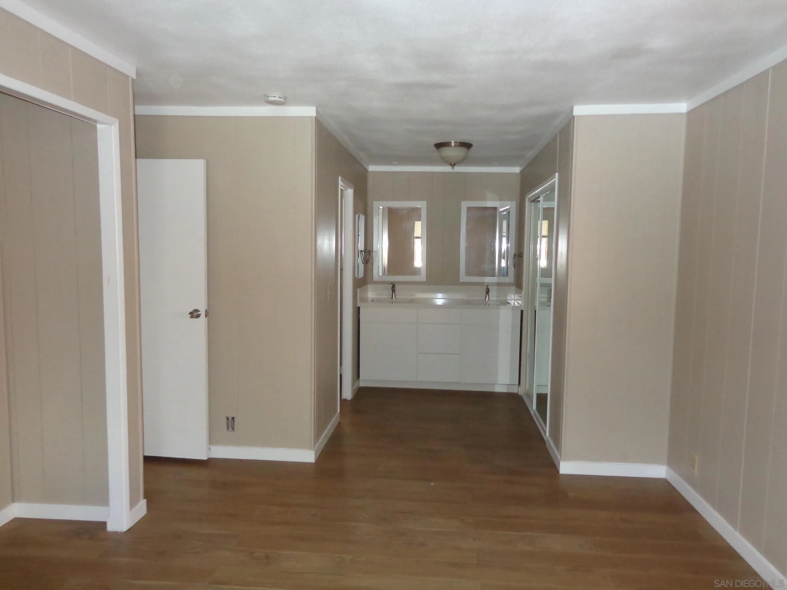 106 Havenview Lane Oceanside, CA 92056 - Photo 17 of 24 a view of a hallway with wooden shelves