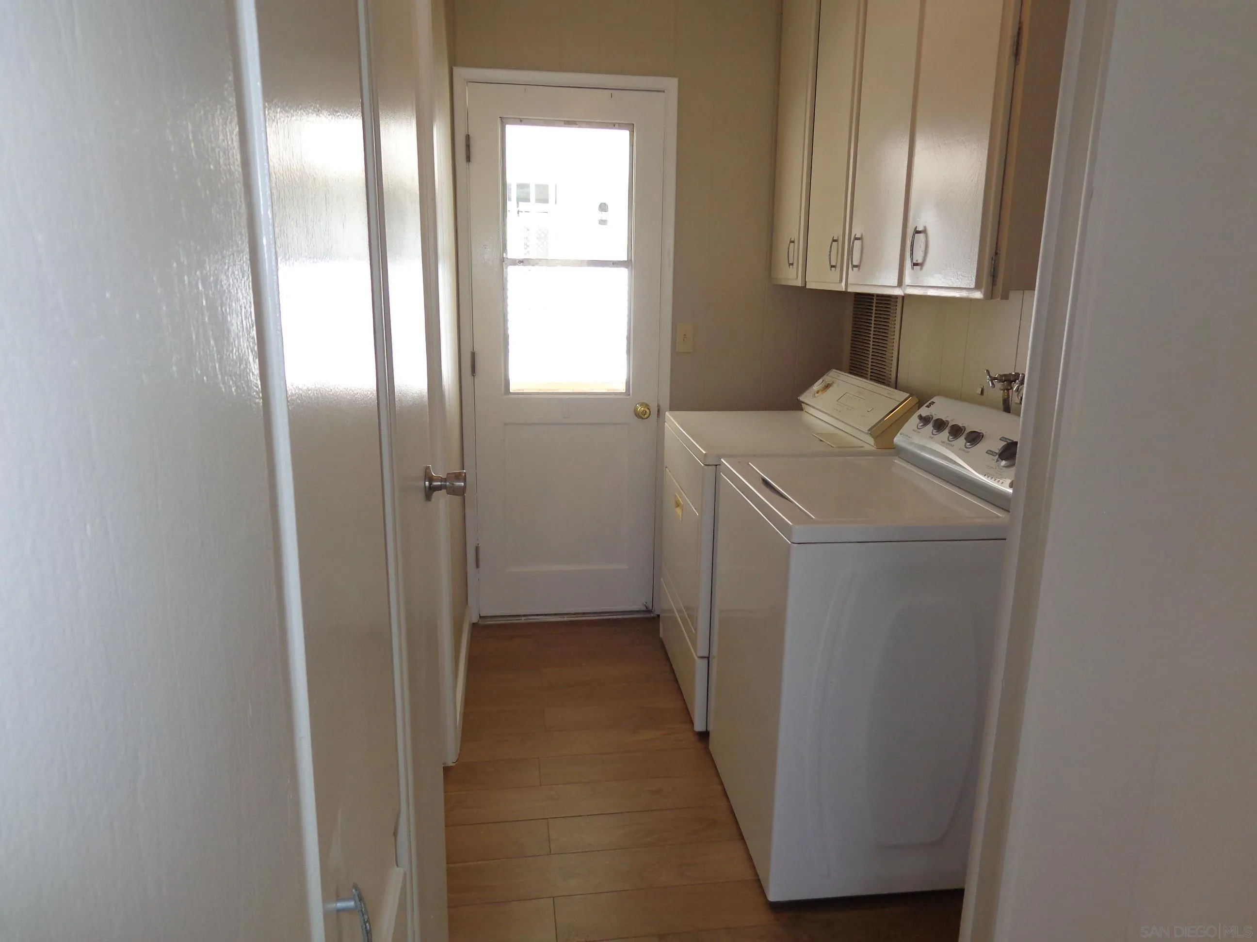 106 Havenview Lane Oceanside, CA 92056 - Photo 23 of 24 a view of a storage and utility room with a washer dryer