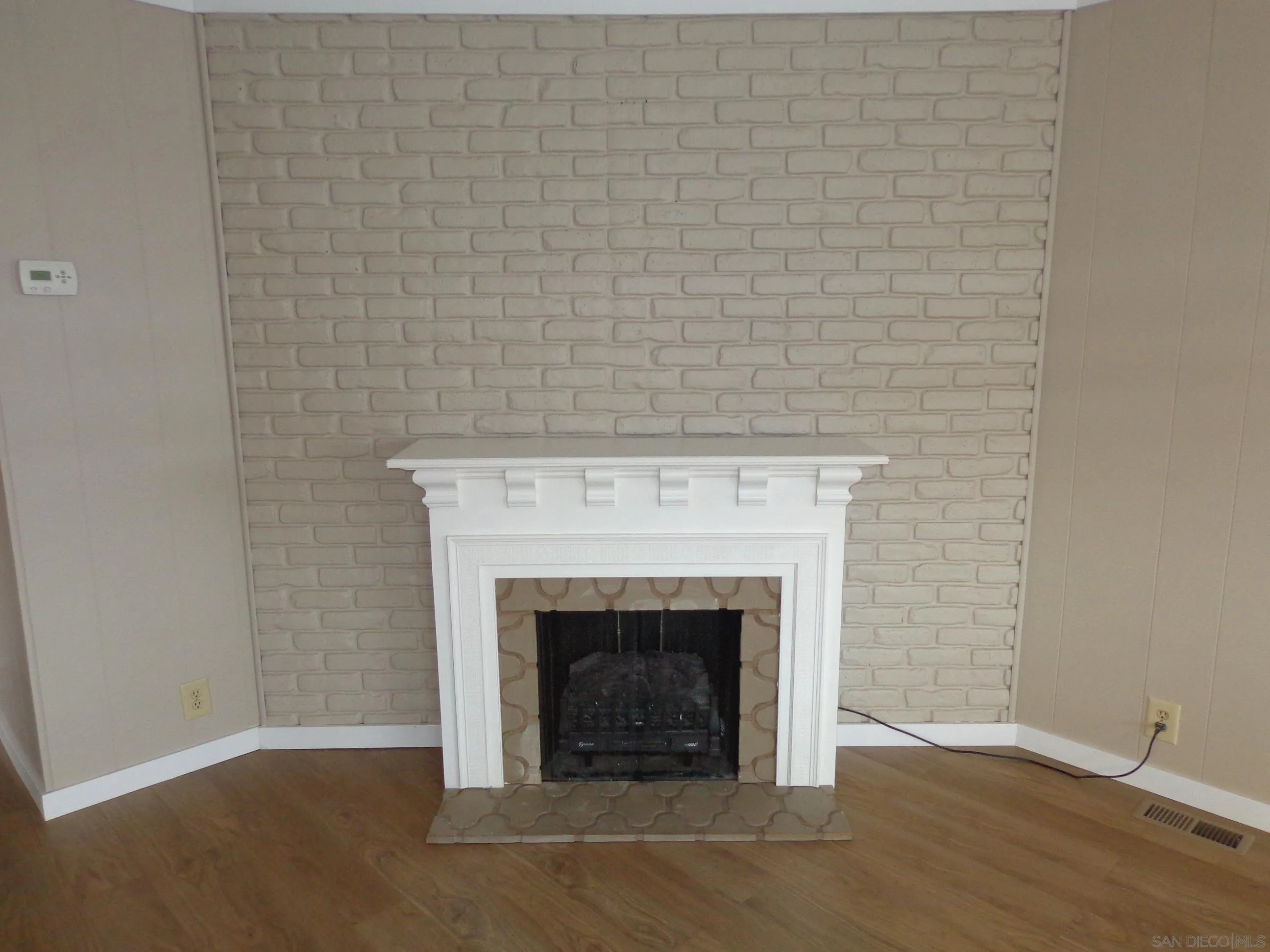 106 Havenview Lane Oceanside, CA 92056 - Photo 9 of 24 a white building with a fireplace