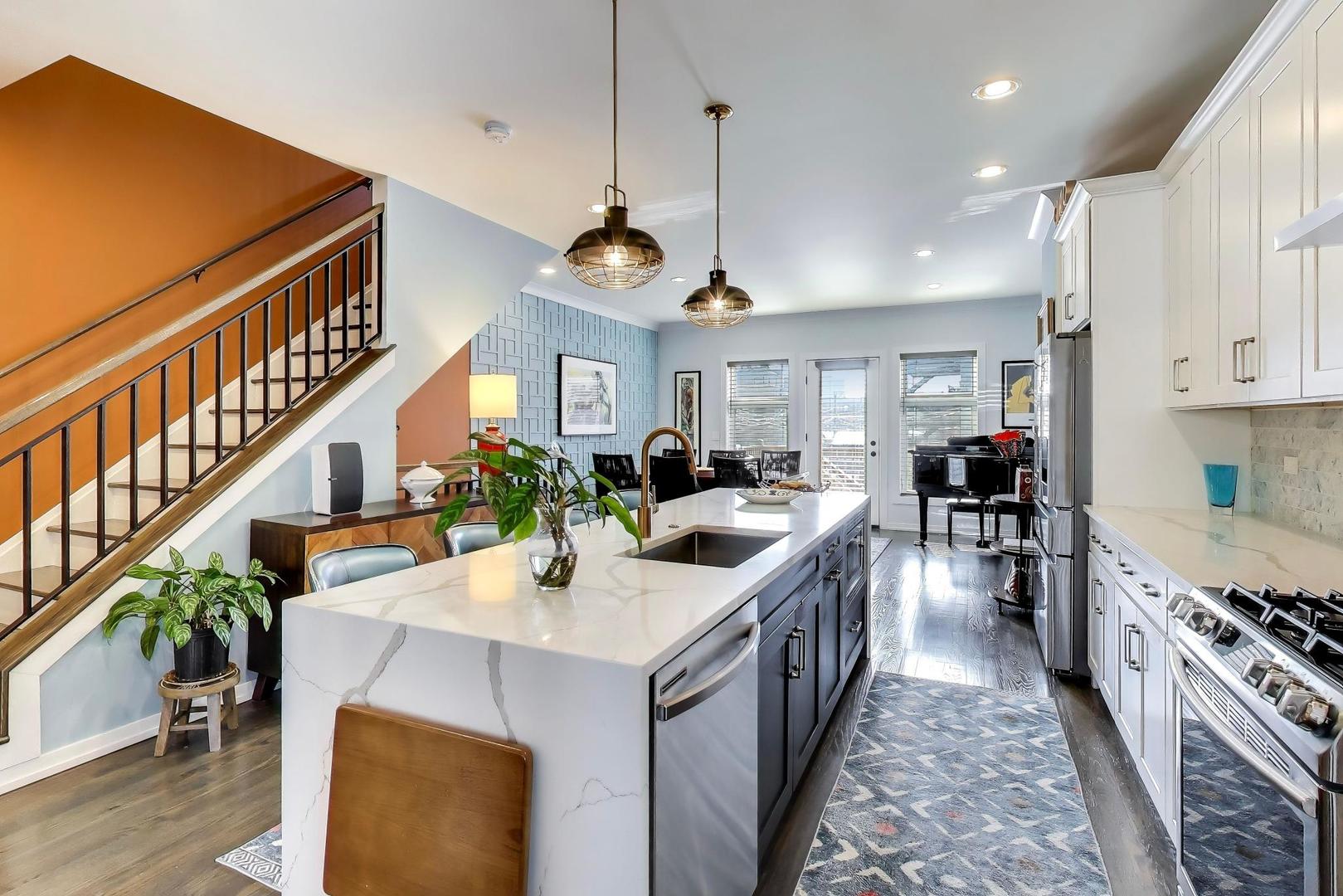 347 East 44th Street Chicago, IL 60653 - Photo 15 of 38 a kitchen with sink stove and cabinets
