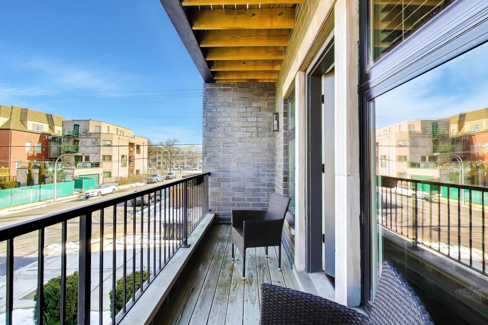 347 East 44th Street Chicago, IL 60653 - Photo 18 of 38 a view of a balcony with wooden floor