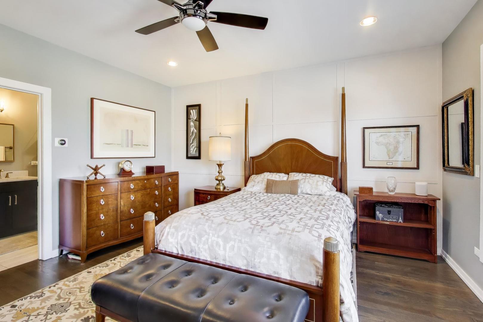 347 East 44th Street Chicago, IL 60653 - Photo 21 of 38 a bedroom with a bed and wooden floor