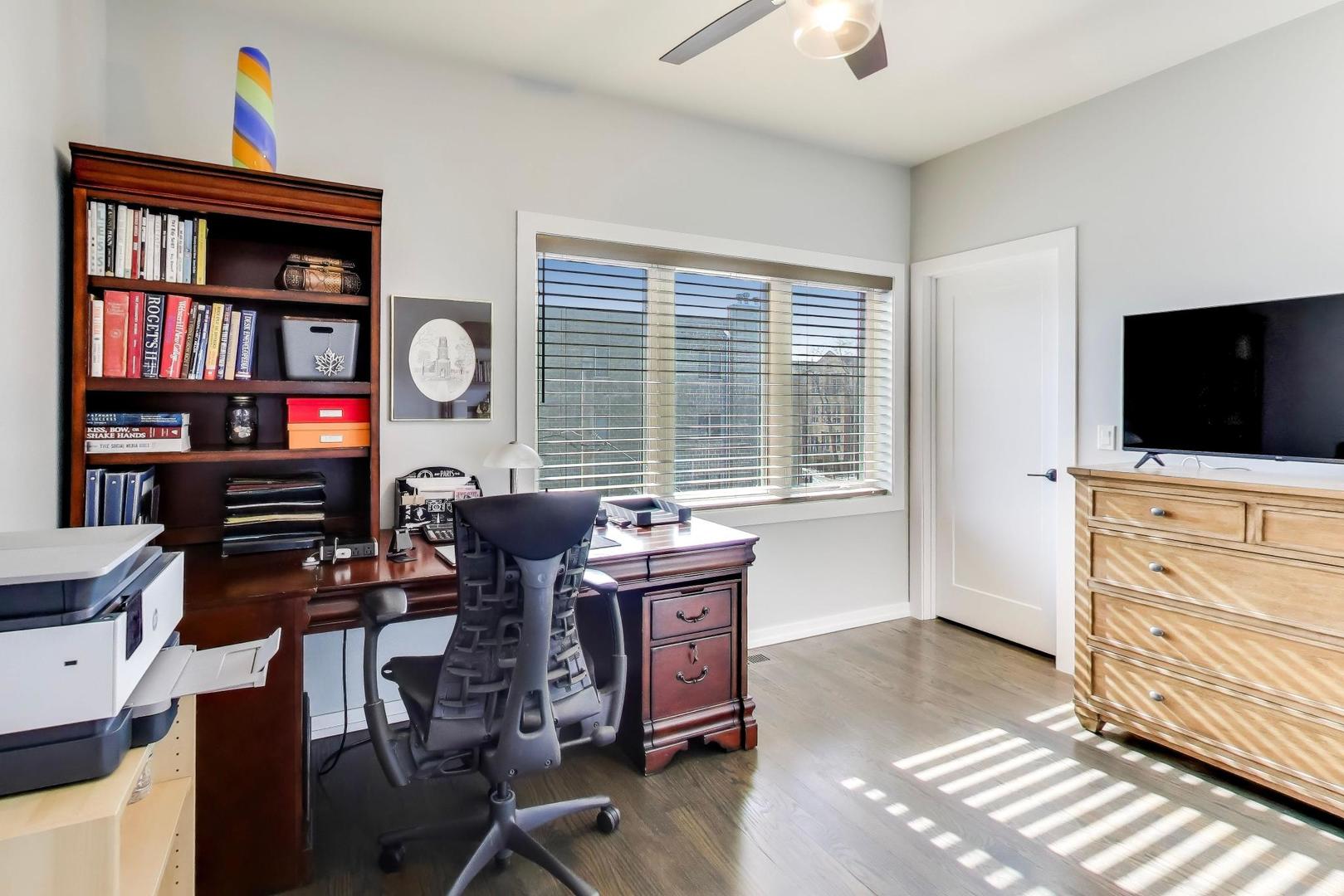 347 East 44th Street Chicago, IL 60653 - Photo 28 of 38 a view of a workspace with furniture and a window