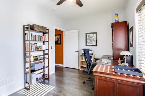 a work room with furniture and wooden floor