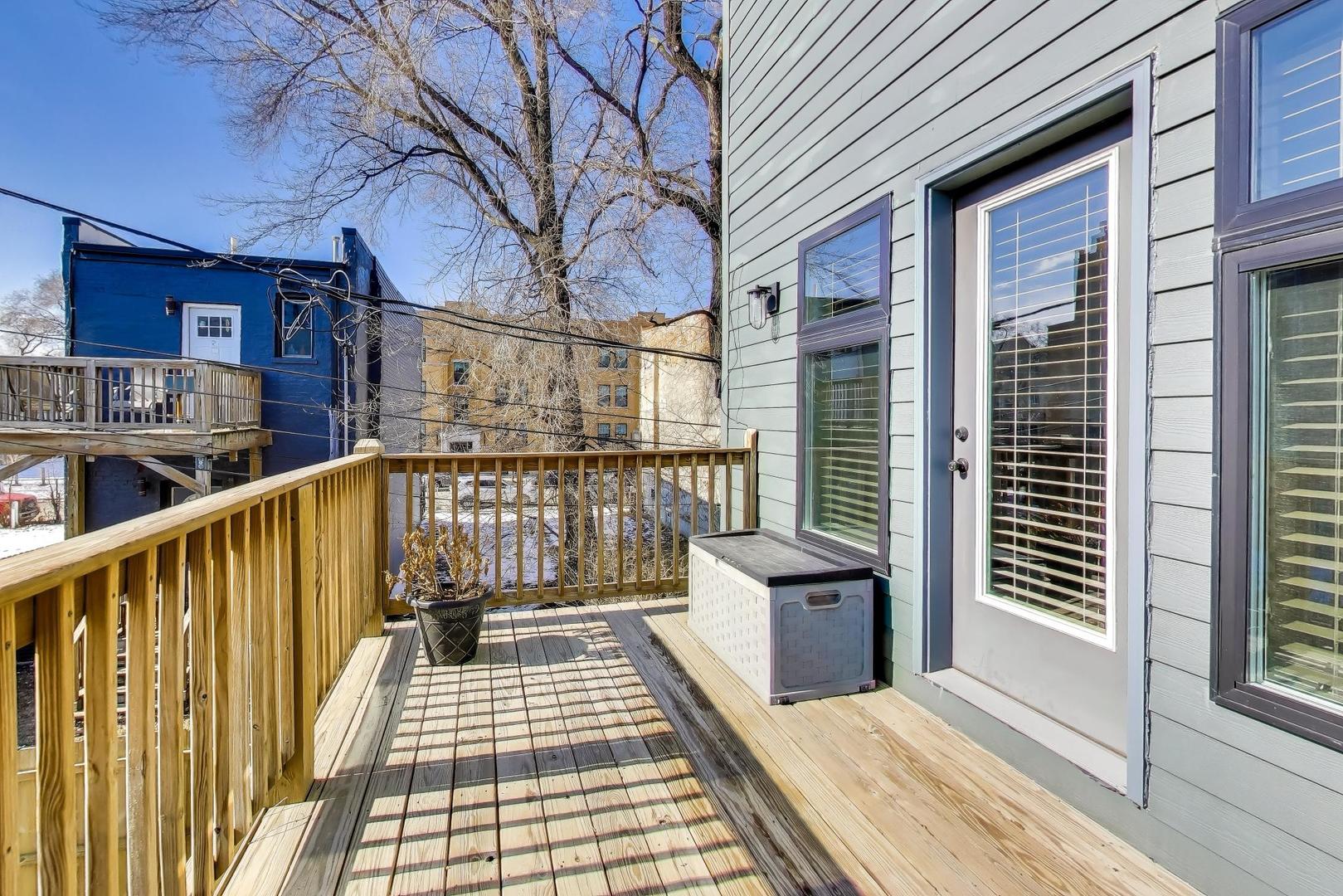 347 East 44th Street Chicago, IL 60653 - Photo 32 of 38 a view of a balcony with wooden floor and fence