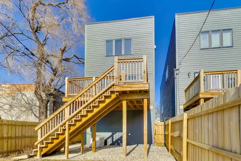 a front view of a house with a street