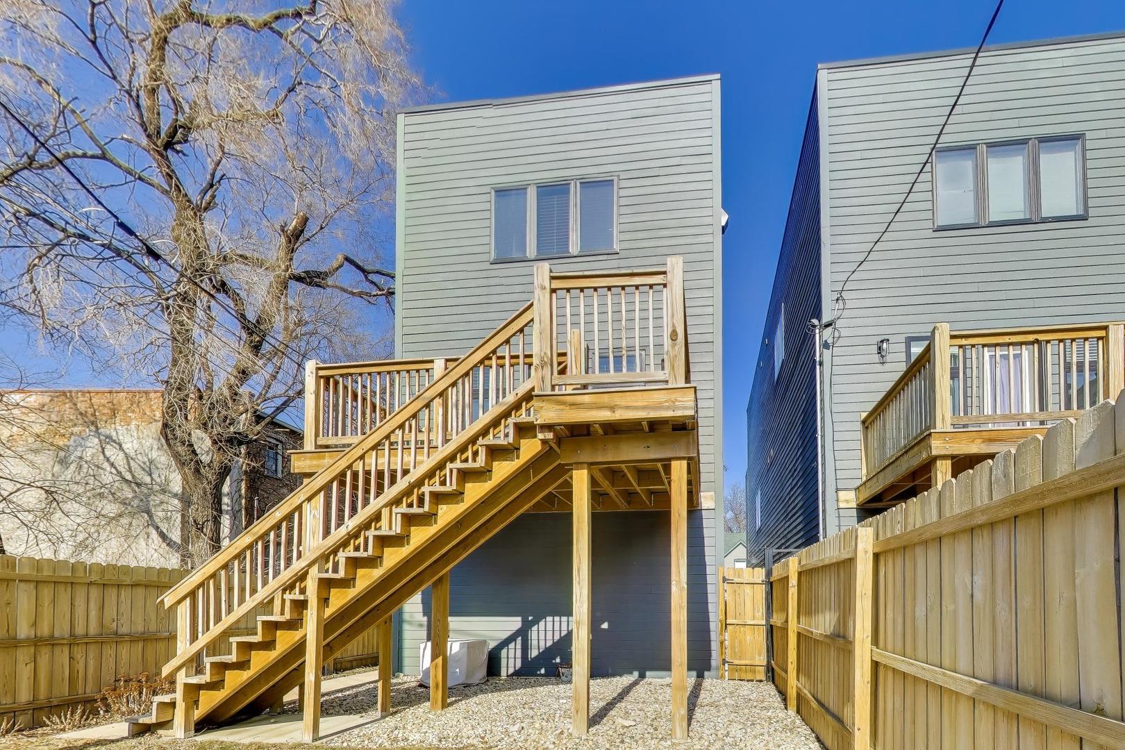 347 East 44th Street Chicago, IL 60653 - Photo 35 of 38 a front view of a house with a street