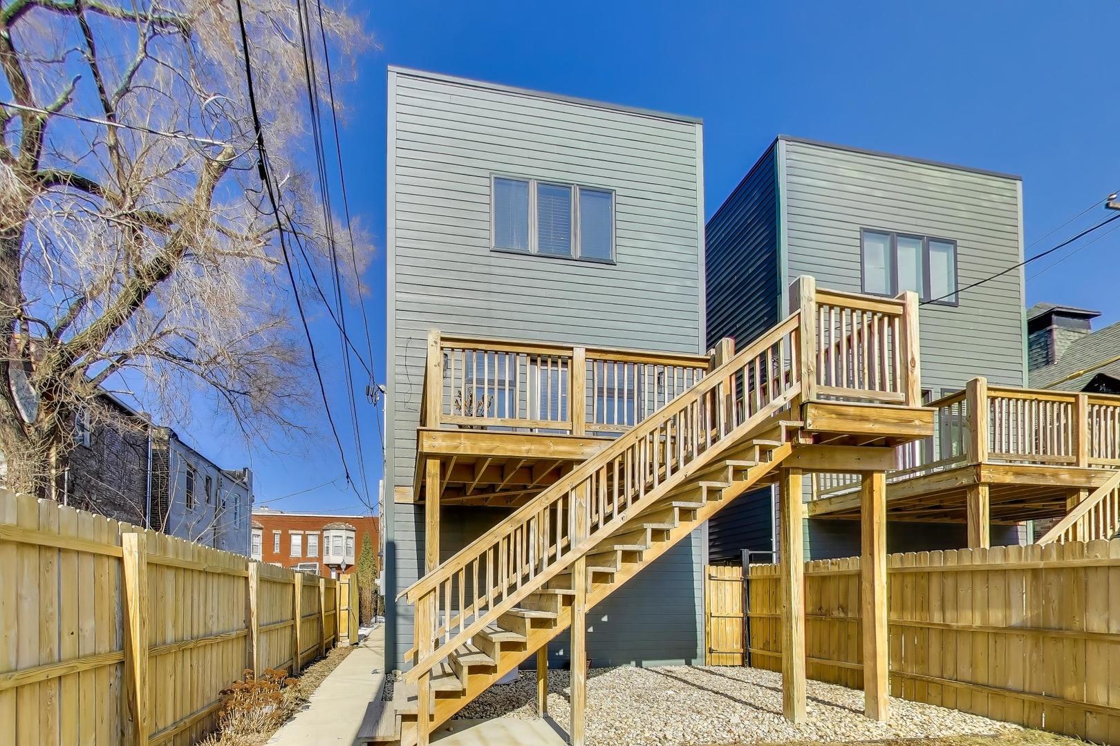 347 East 44th Street Chicago, IL 60653 - Photo 36 of 38 a view of a house with wooden stairs and stairs
