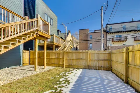 a view of a balcony with wooden floor