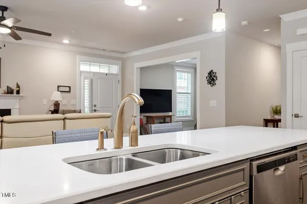 a kitchen with a sink and a refrigerator