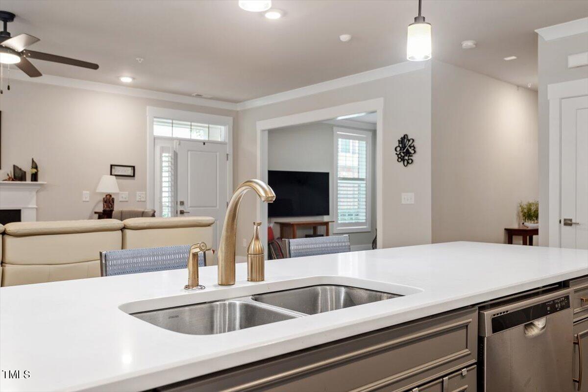10310 Sablewood Drive, Unit 115 Raleigh, NC 27617 - Photo 13 of 28 a kitchen with a sink and a refrigerator