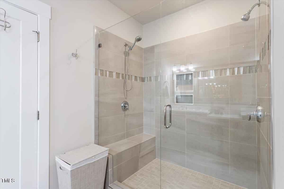 10310 Sablewood Drive, Unit 115 Raleigh, NC 27617 - Photo 18 of 28 a bathroom with a shower and toilet