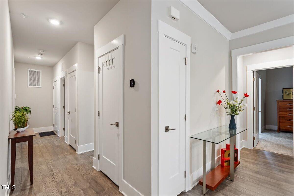 10310 Sablewood Drive, Unit 115 Raleigh, NC 27617 - Photo 26 of 28 a view of an entryway with wooden floor and livingroom view
